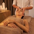 Healing hands. A beautiful young woman enjoying a massage at the spa.