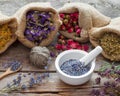 Healing herbs in hessian bags and mortar of lavender Royalty Free Stock Photo