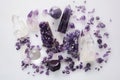 Healing purple amethyst stones on white background. Crystals for ritual