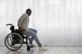 Concentrate tense mature african american man disabled stands up from wheelchair