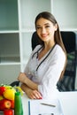 Health and Beauty. Portrait of a Happy Dietitian in the Light Room. Healthy Nutrition. A Doctor with a Beautiful Smile