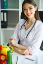 Health and Beauty. Portrait of a Happy Dietitian in the Light Room. Healthy Nutrition. A Doctor with a Beautiful Smile