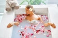 Health, Beauty. Woman Spa Body Care. Relaxing Flower Rose Bath Royalty Free Stock Photo