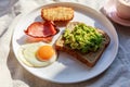 health breakfast, bacon and egg, toast and avocado