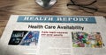 Health care availability newspaper on table