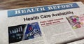 Health care availability newspaper on table