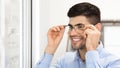 Portrait of smiling young man wearing spectacles Royalty Free Stock Photo