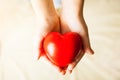 Child hands holding red heart, health care, donate and family insurance concept Royalty Free Stock Photo