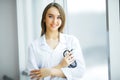 Health Care. Female doctor standing in hospital corridor. Medical Concept