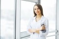 Health Care. Female doctor standing in hospital corridor. Medical Concept