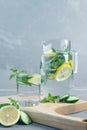 Health care, fitness, healthy food concept. Fresh cool mint lemon cucumber pour water, cocktail, detox drink, lemonade in a glass Royalty Free Stock Photo