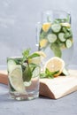 Health care, fitness, healthy food concept. Fresh cool mint lemon cucumber pour water, cocktail, detox drink, lemonade in a glass Royalty Free Stock Photo