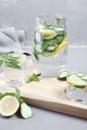 Health care, fitness, healthy food concept. Fresh cool mint lemon cucumber pour water, cocktail, detox drink, lemonade in a glass Royalty Free Stock Photo