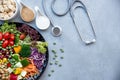 Health Care. Fresh vegetable salad with medical stethoscope and equipment dumbbell for diet