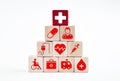 Health care insurance or service concept. Medical healthcare icons on wooden cubes