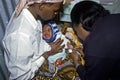 Health care for Kenyan baby with loving mother