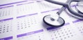Health care and medical exam schedule calendar, reminder or appointment concept, doctor's stethoscope Royalty Free Stock Photo