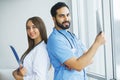 Health Care. Medical Team Examining X-ray Report in Corridor. Me Royalty Free Stock Photo