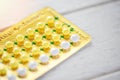 Health care and medicine contraceptive pill prevent pregnancy contraception concept - birth control on wooden background Royalty Free Stock Photo