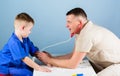 Health care. Pediatrician concept. Careful pediatrician check health of kid. Medical examination. Hospital worker Royalty Free Stock Photo