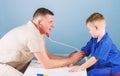 Health care. Pediatrician concept. Careful pediatrician check health of kid. Medical examination. Hospital worker Royalty Free Stock Photo