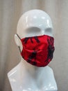 Health care protective mask with fashionable design on a plastic mannequin head