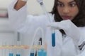 Health care researcher working in life science laboratory. Young female african american  research scientist preparing and Royalty Free Stock Photo