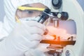 Health care researchers working in life science laboratory and analyzing microscope slides in research lab Royalty Free Stock Photo