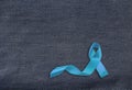 Health care and symbolics concept. Close up of blue prostate cancer awareness ribbon