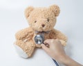 Health care teddy bear heart stethoscope on white background