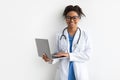 Portrait of black female medical practitioner holding laptop Royalty Free Stock Photo