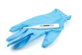 Health care thermometer and blue glove Royalty Free Stock Photo