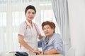 Health care worker helping an elderly patient. Royalty Free Stock Photo