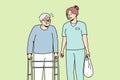 Health care worker helps elderly disabled person with walking frame. Royalty Free Stock Photo
