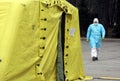 Health care workers wear protective suits as they wait for patients to be tested for coronavirus disease COVID-19 in Riga, Latvi