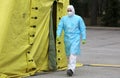 Health care workers wear protective suits as they wait for patients to be tested for coronavirus disease COVID-19 in Riga, Latvi Royalty Free Stock Photo