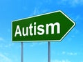 Health concept: Autism on road sign background