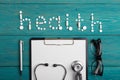 Health concept - pills, stethoscope, clipboard and glasses Royalty Free Stock Photo