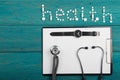 Health concept - pills, stethoscope, clipboard and watches Royalty Free Stock Photo