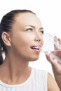 Health Concept: Portrait of Happy Smiling Caucasian Brunette Woman Drinking Clear Water from Glass. Isolated On White Royalty Free Stock Photo