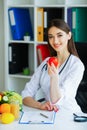 Health. Diet and Healthy. Doctor Dietitian Holding Fresh Tomatoes In Her Hands And Smiles. Beautiful and Young Doctor. High Royalty Free Stock Photo