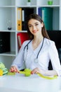 Health. Diet and Healthy Nutrition. Doctor Dietitian Holding in