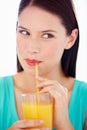 Health, drink and face of woman with juice for nutrition, wellness and hydration in studio Happy, thirsty and person