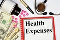 Health expenses. A text inscription in the treatment planning notebook Royalty Free Stock Photo