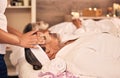 Health, facial massage and senior man at a spa for wellness, self care and zen treatment. Relax, calm and masseuse hands Royalty Free Stock Photo