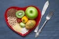 Health food on a red heart plate diets abstract still life