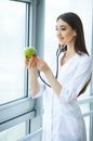 Health. Healthy Diet. Doctor Dietitian Holding in Hands Fresh Gr Royalty Free Stock Photo