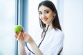 Health. Healthy Diet. Doctor Dietitian Holding in Hands Fresh Gr Royalty Free Stock Photo