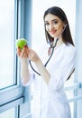 Health. Healthy Diet. Doctor Dietitian Holding in Hands Fresh Gr Royalty Free Stock Photo