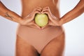 Health, heart shape and woman with a apple for a healthy, nutrition and organic diet snack. Fitness, wellness and slim Royalty Free Stock Photo